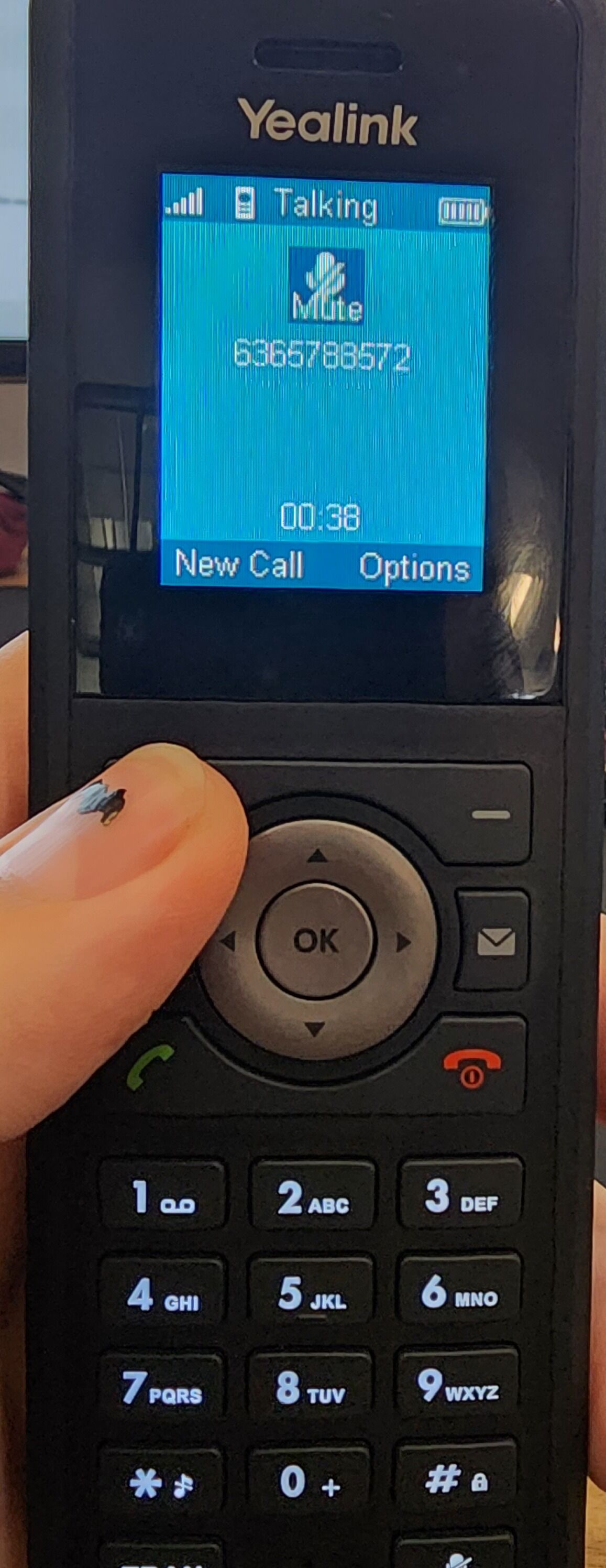 Screenshot of: Our first step while on a call is to press "new call". This will place the caller on hold so that we can dial our "park orbit number". 