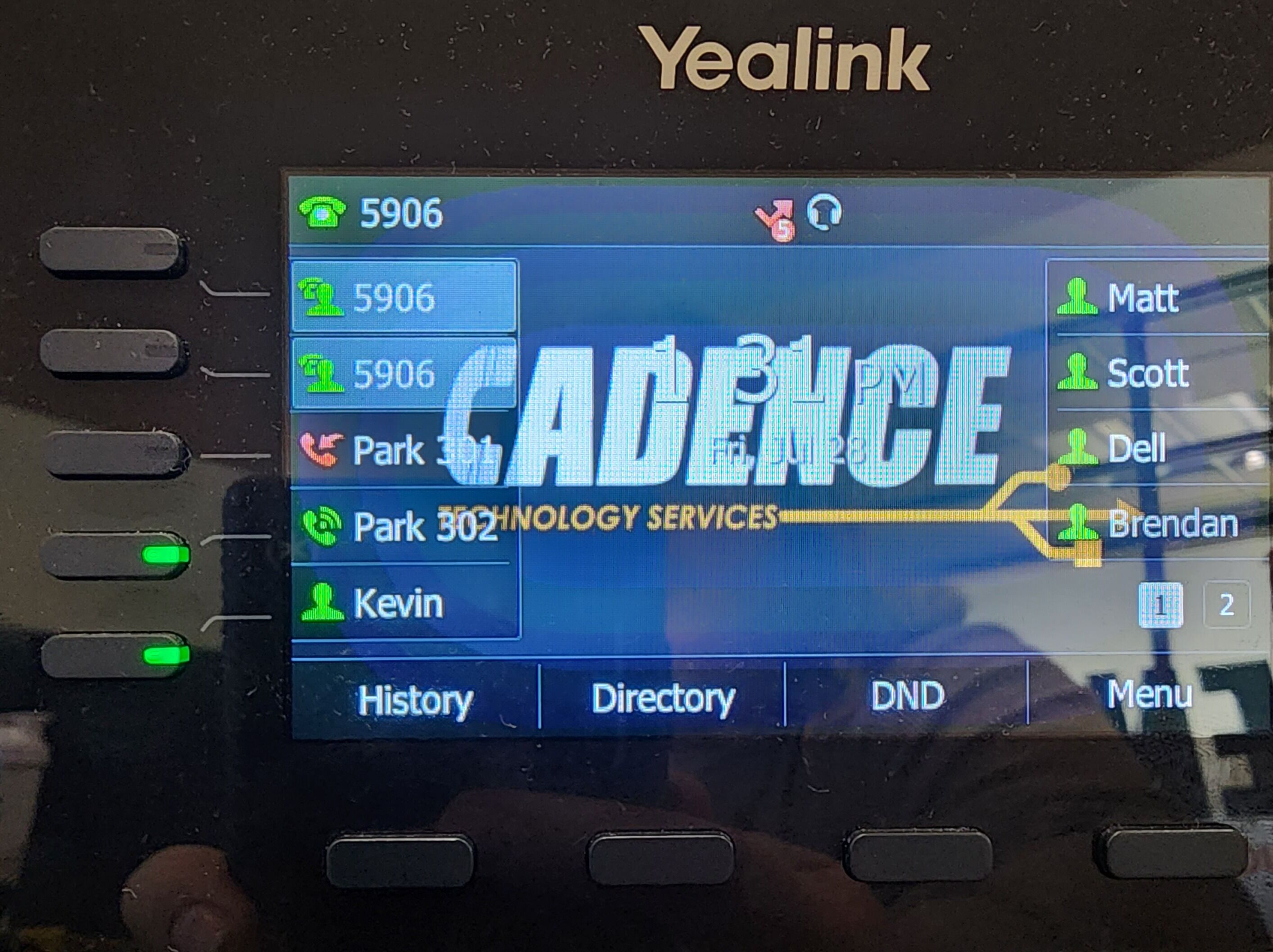 Screenshot of: You'll notice that you are no longer connected to a call on the cordless phone and if you look at your desk phone you will see a park space has been taken up and turned red. If you press the corresponding button for that park it will then pick up the call on that desk phone. 
