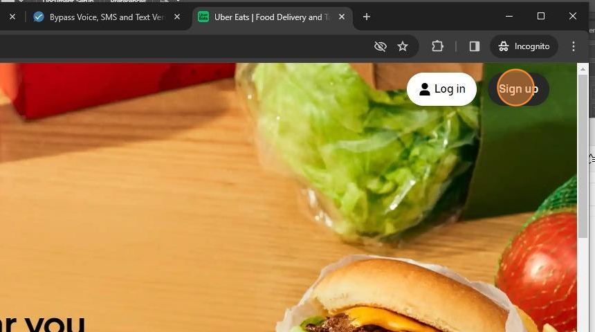 The Uber Eats homepage with the Sign-Up button highlighted.