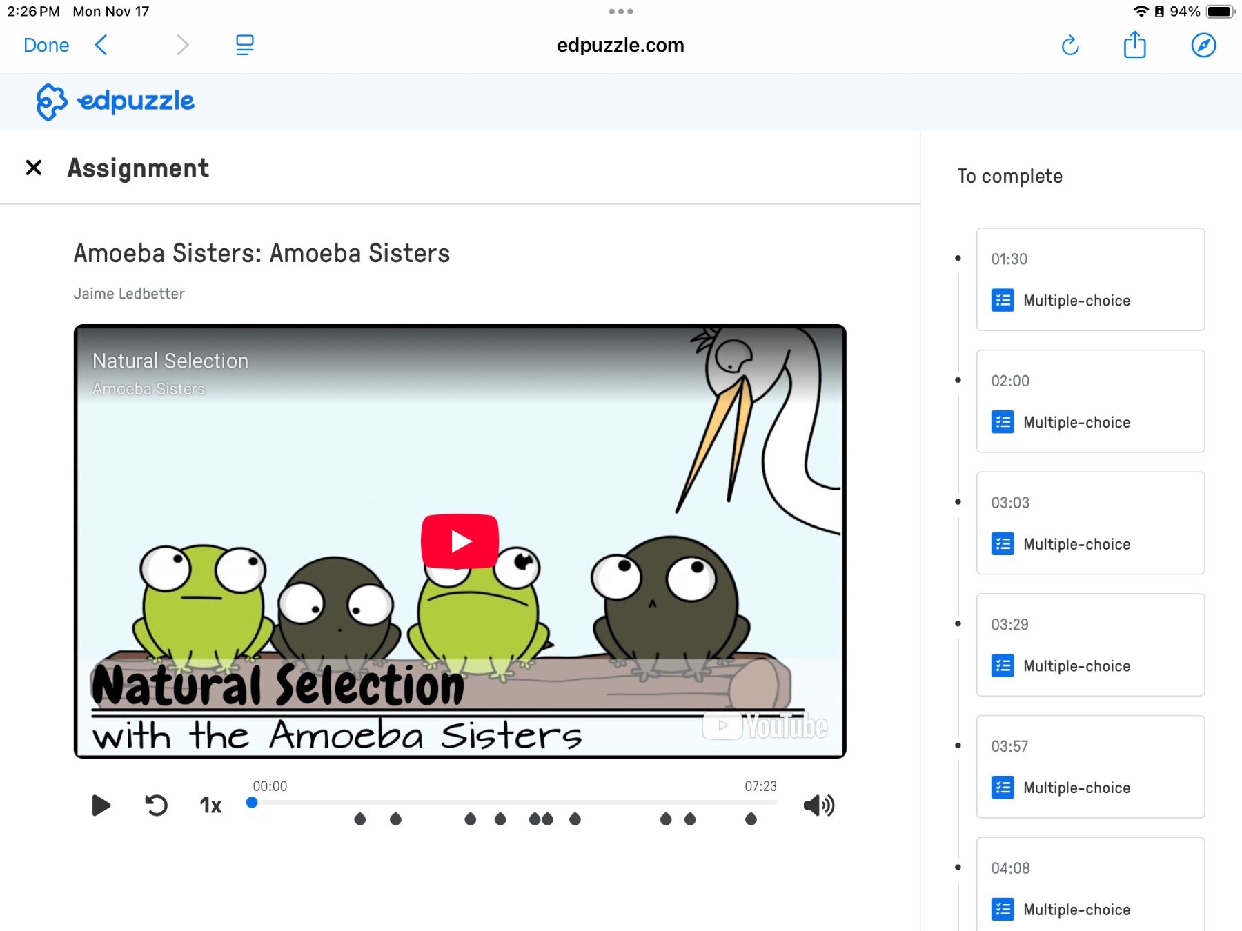 Edpuzzle video titled "Natural Selection" by Amoeba Sisters. Cartoon frogs look anxious as a bird approaches. Video includes multiple-choice segments to complete.