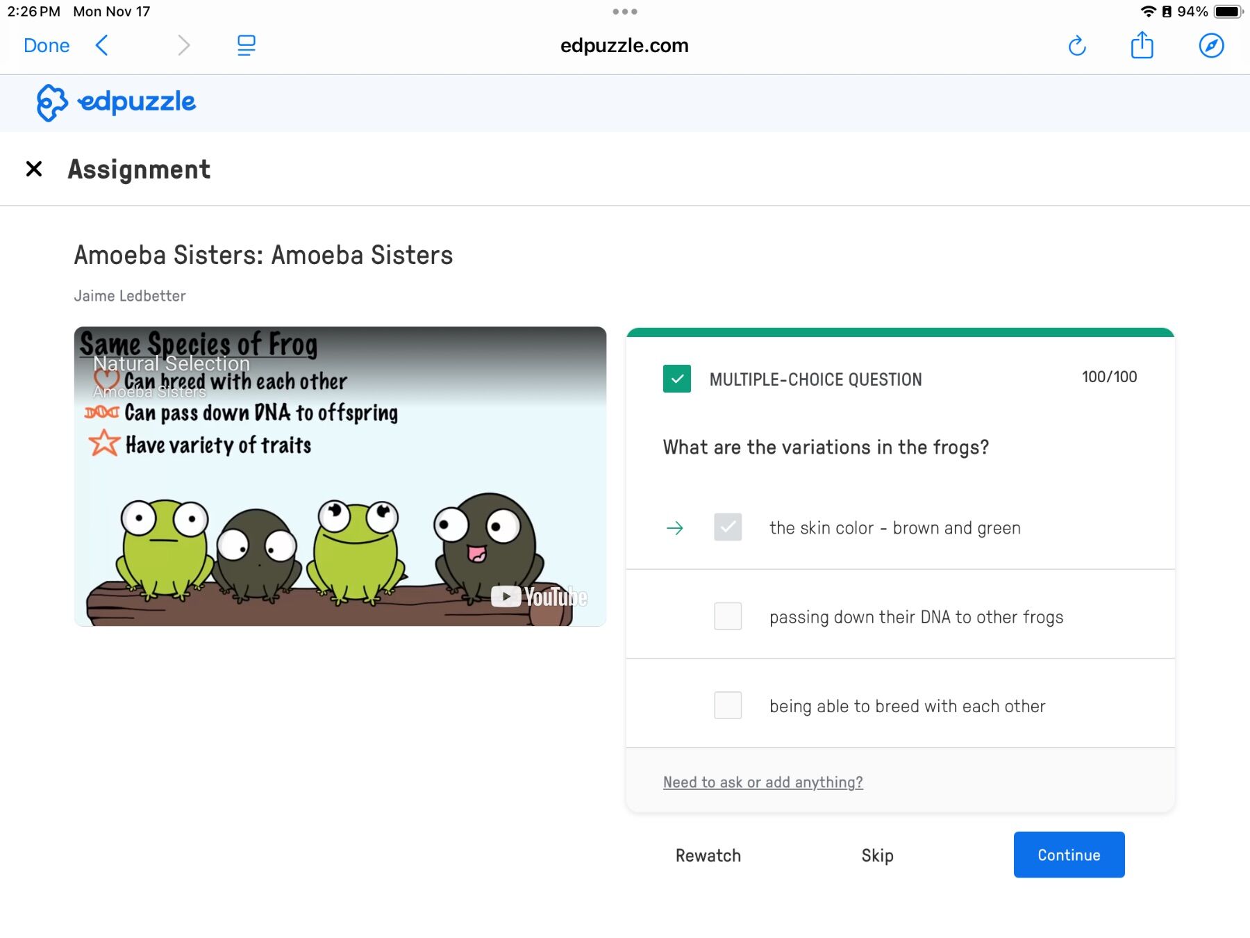 Screenshot of an Edpuzzle biology assignment with cartoon frogs illustrating frog species traits. Includes a multiple-choice question about frog variation, which is correctly answered as skin color.
